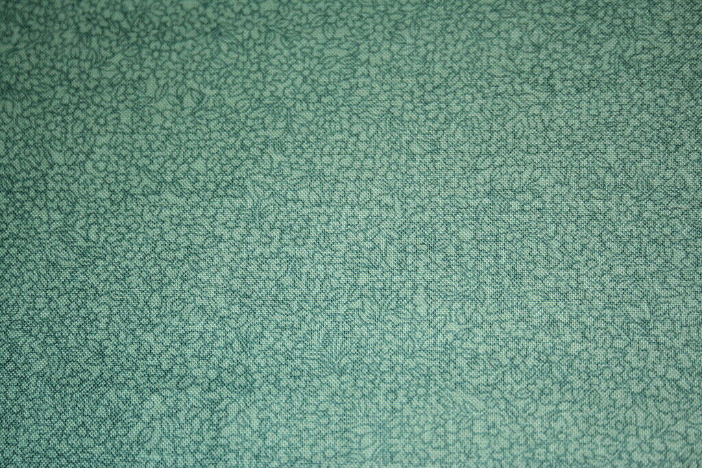 PRISIMS-TINY GREEN FLOWERS ON GREEN FROM HOFFMAN- COTTON FABRIC