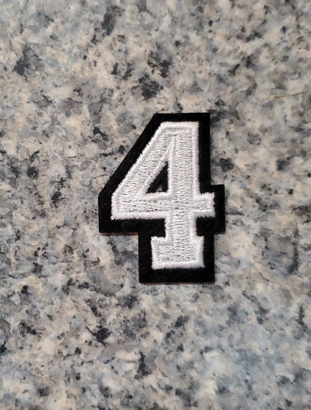 Number 4 Patch. White With Black border. Embroidered. Iron On. 1″x1.5″