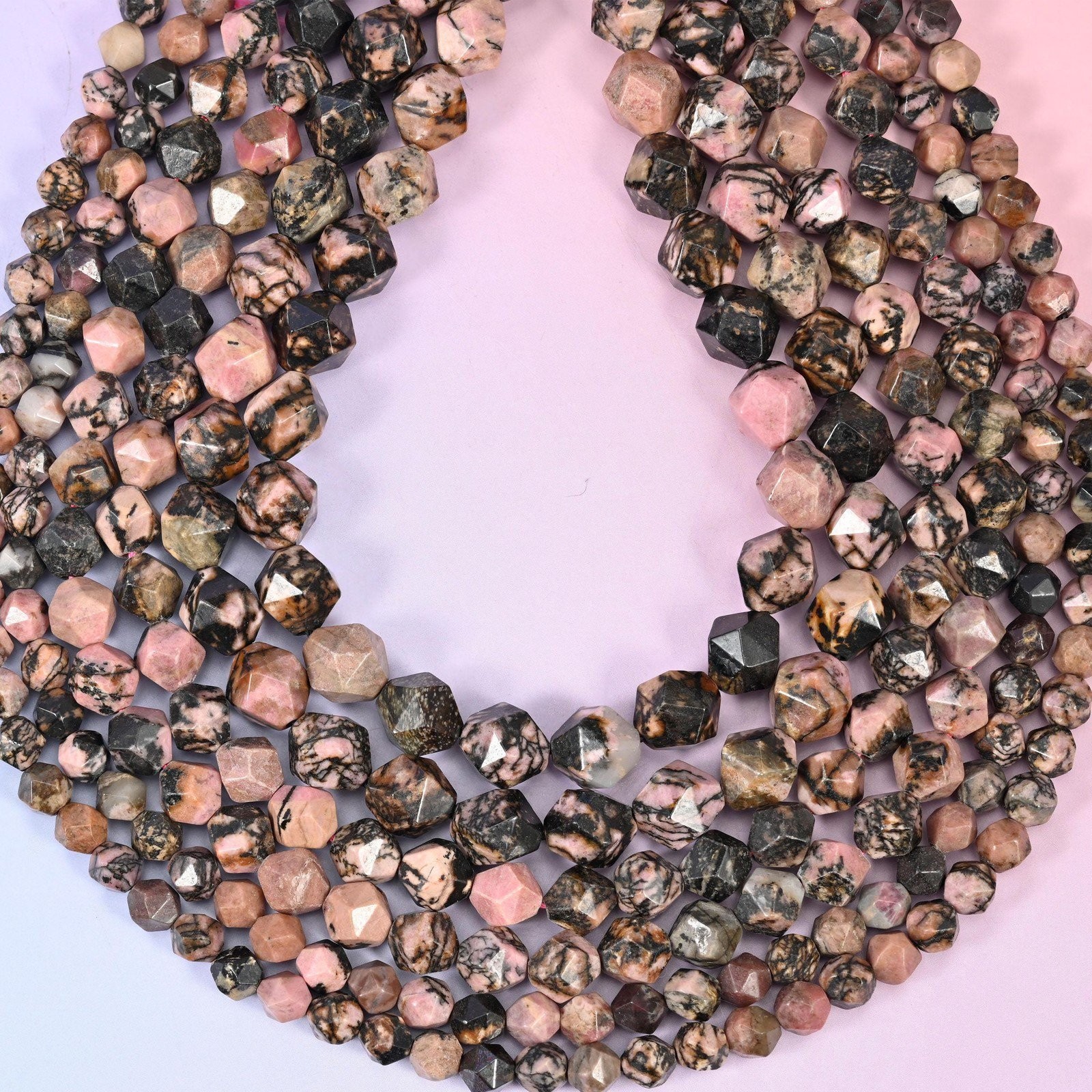 Rhodonite Beads: Faceted Diamond Star Cut, 6-10mm, 15.5 inch Strand