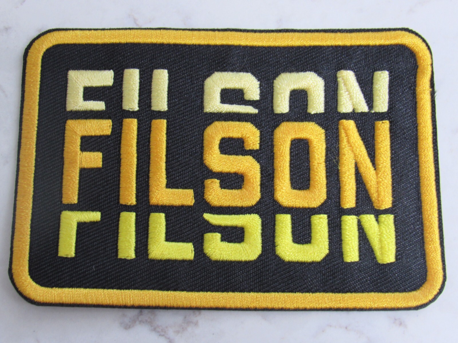 Filson Retro Black And Gold Iron On Embroidered Patch!