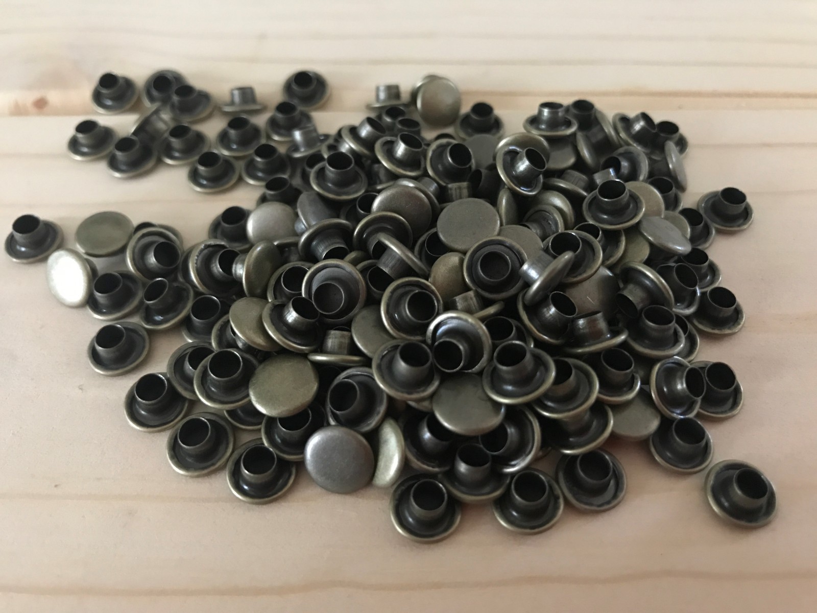 Double Cap Rivets in: Silver, Gold, Black, Antique Brass, and Matte Gray