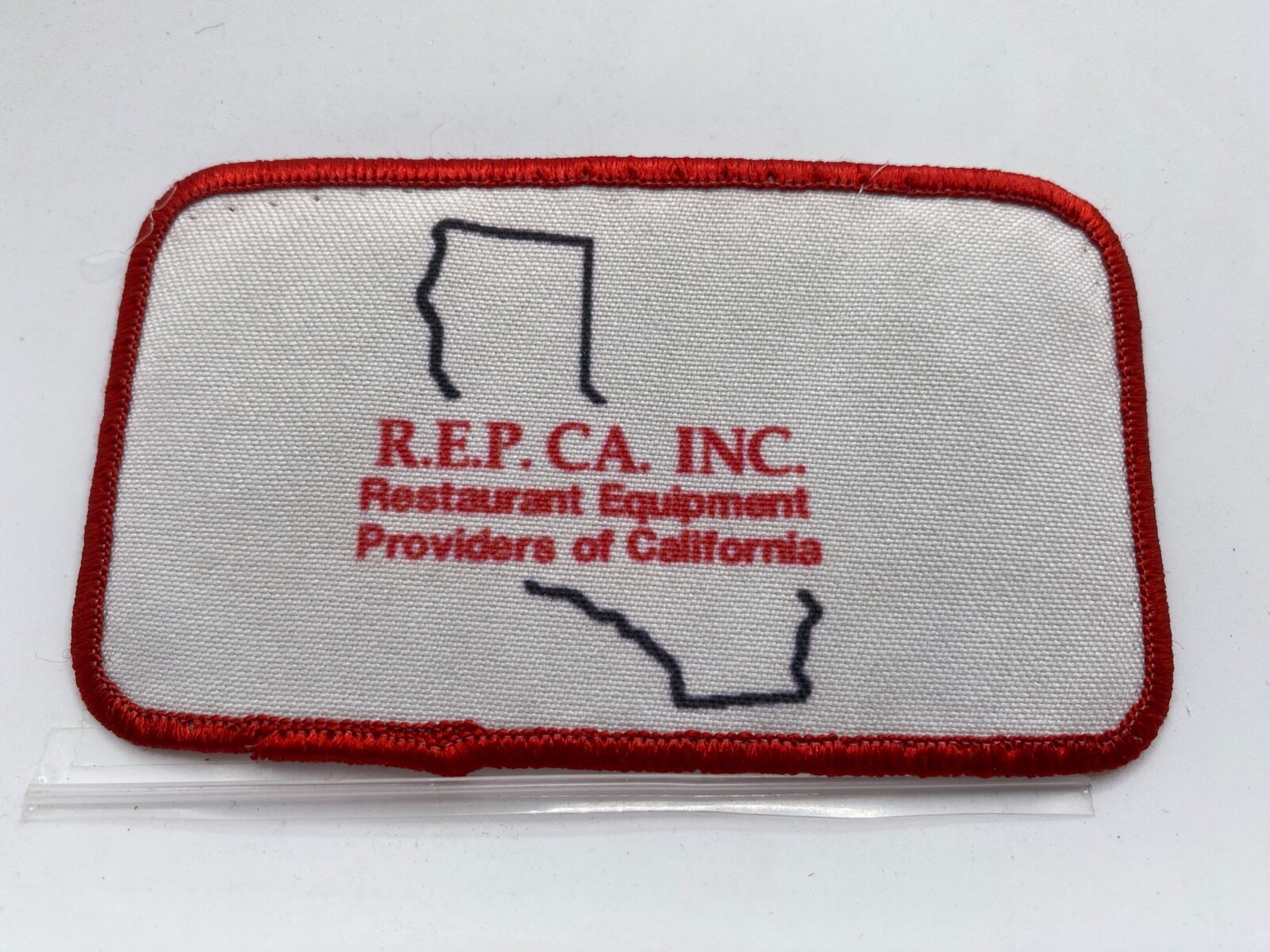 RESTAURANT EQUIPMENT PROVIDERS VINTAGE USED SILK SCREEN SEW ON NAME PATCH TAG