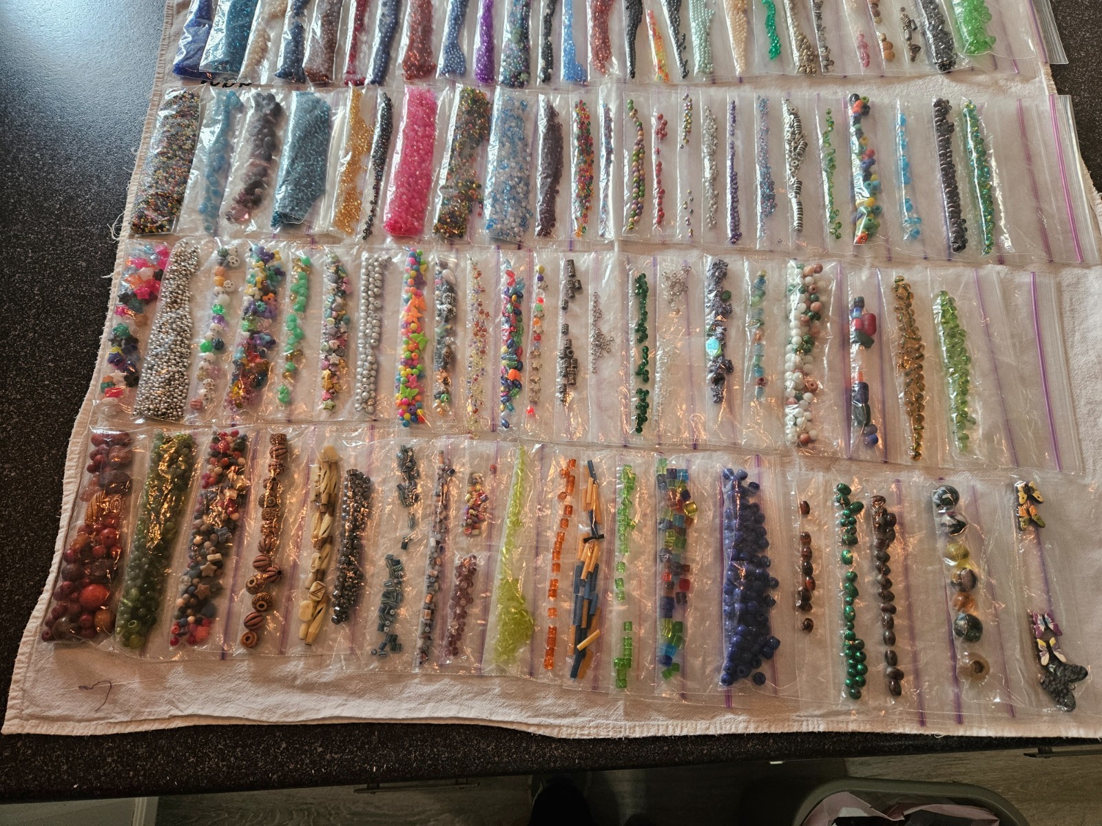 Huge lot of 95+ bags of assorted beads; glass metal wood plastic beads charms