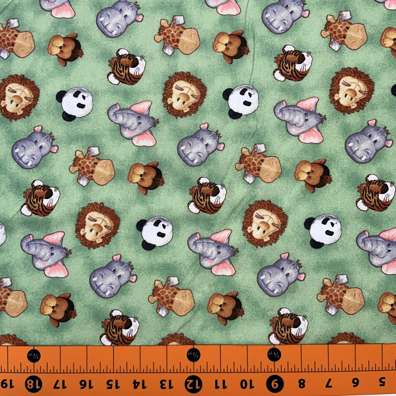 Flannel Fabric | Fabric Traditions Jungle Babies Animal Head Toss Green | YARD