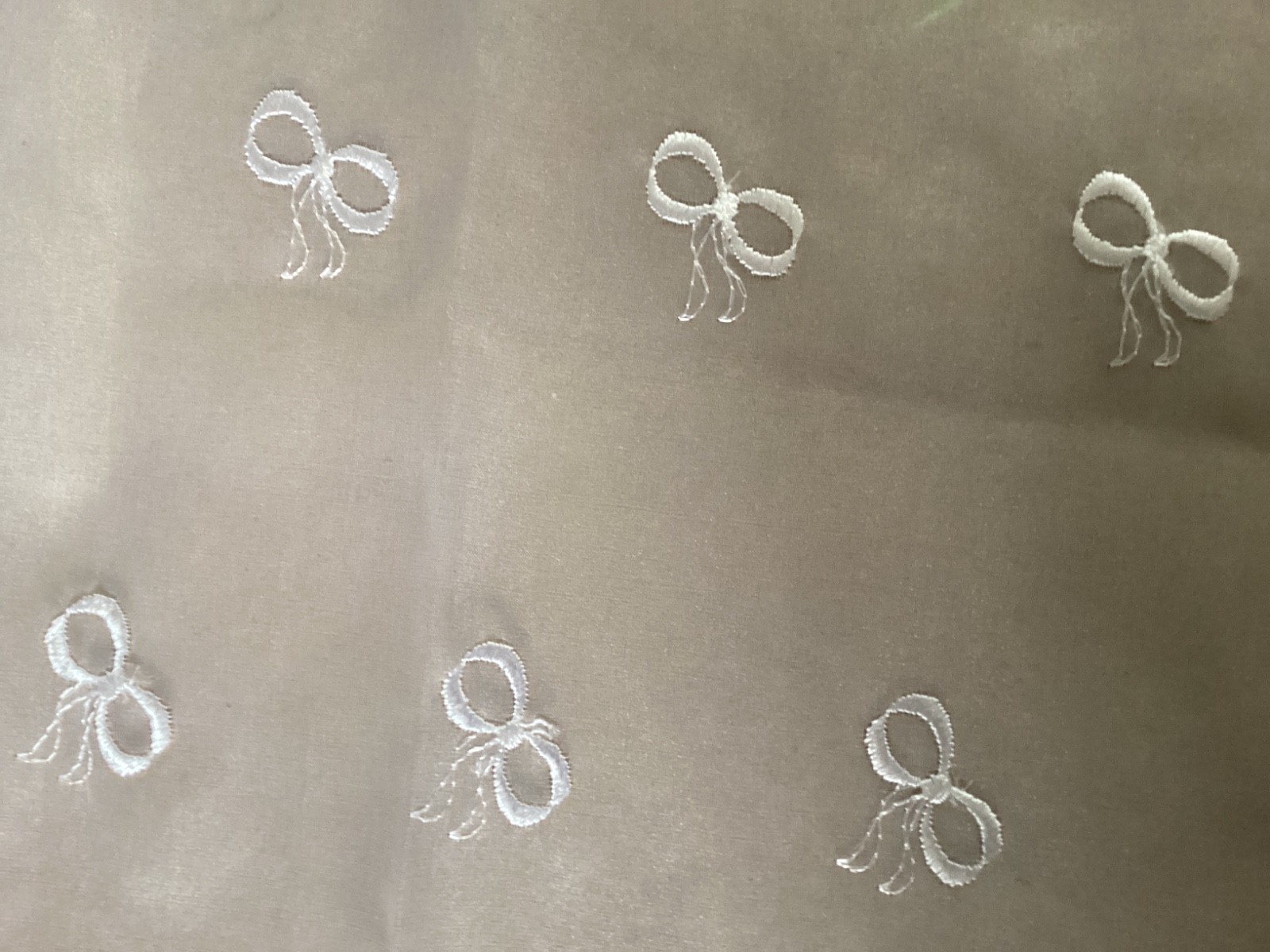 9 1/2 YDS ALLOVER WHITE BOW RAYON EMBROIDERED ON POLY ORGANZA